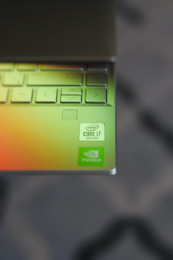 Detail of a laptop keyboard with Intel Core i7 sticker, captured indoors.